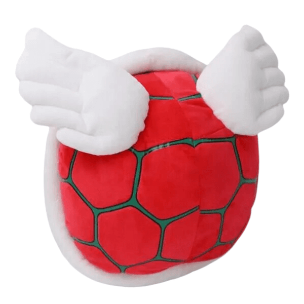 Carapace de Paratroopa en peluche rouge, avec des motifs polygonaux bordés de vert et de grandes ailes blanches.