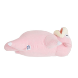 Coussin Ramoloss en peluche rose pâle, avec de longues oreilles crème et brunes et une queue arrondie.