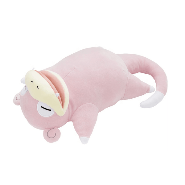 Coussin Ramoloss en peluche rose pâle, avec un museau crème, de petites pattes et une longue queue blanche.
