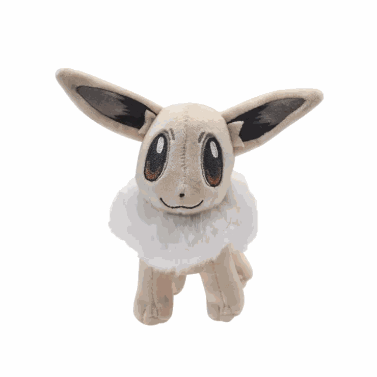 Peluche Évoli Shiny beige et crème en tissu doux, avec de longues oreilles, de grands yeux bruns et un col en fourrure blanche.