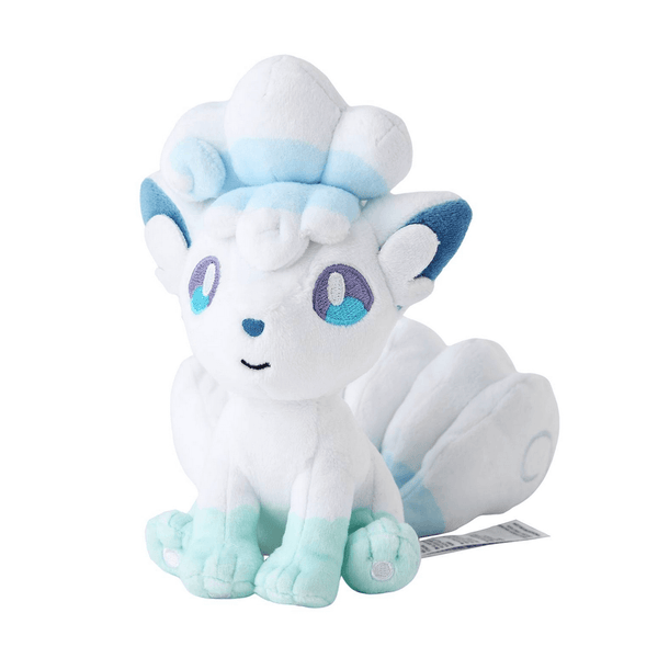 Peluche Goupix d'Alola blanc aux accents bleu pâle, avec de grands yeux brodés et plusieurs queues touffues.