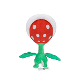 La Plante Piranha en peluche rouge à pois blancs, avec une tige verte et de larges feuilles assorties.