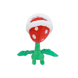 La Plante Piranha en peluche rouge à pois blancs, avec une large mâchoire blanche et une tige verte feuillue.