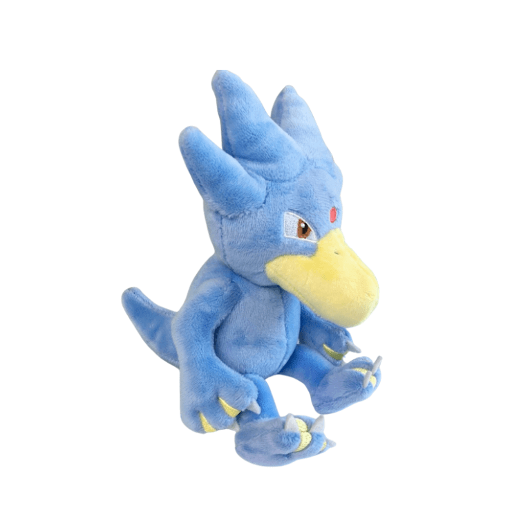 peluche Akwakwak bleue en tissu doux, avec un large bec jaune, une crête à trois pointes et une queue.