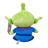 peluche Alien verte et bleue en tissu doux, vue de dos, avec une tête ronde, des oreilles pointues et une combinaison