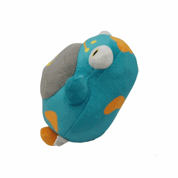 peluche Ampibidou turquoise en tissu, avec des taches orange, une grande zone grise et un œil blanc proéminent