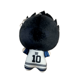 peluche Barou Shouei en tissu noir et blanc, vue de dos avec maillot numéro 10 et détails bleus