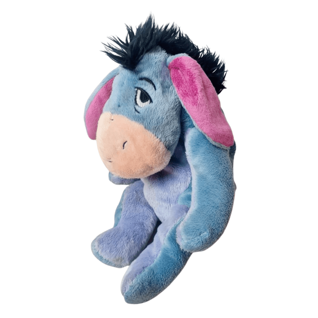 Peluche Bourriquet en tissu bleu et mauve, avec de longues oreilles roses, une crinière noire ébouriffée et un museau beige.
