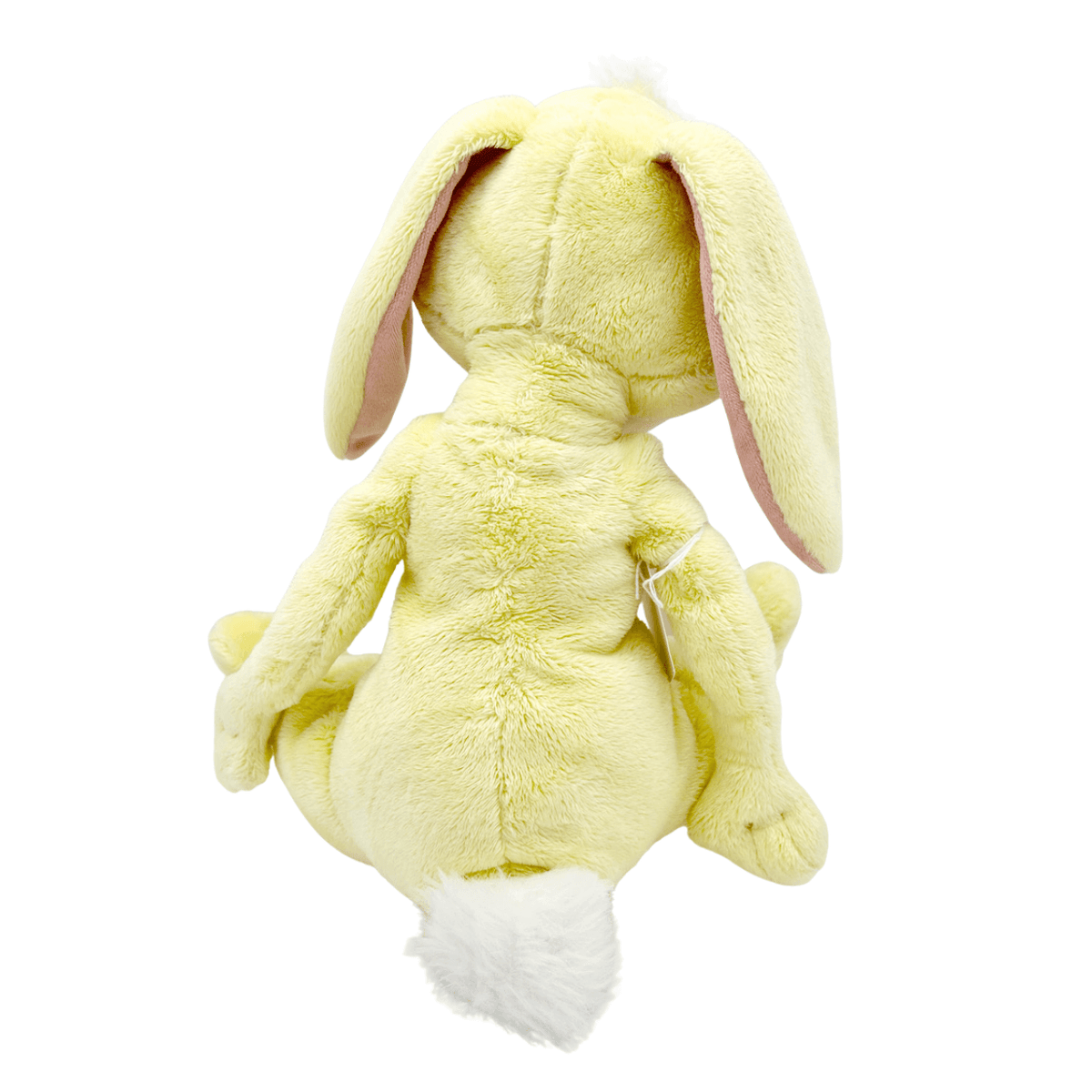 Peluche Coco Lapin jaune pâle en tissu doux, vue de dos, avec de longues oreilles pendantes et une queue blanche duveteuse.