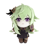 Peluche Collei aux cheveux vert clair, yeux violets brodés et tenue sombre avec détails bruns et verts