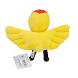 Peluche Condart jaune au corps ailé, avec une tête arrondie rouge et jaune et deux pattes noires.