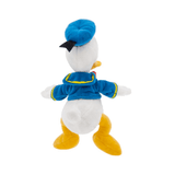Peluche Donald Duck en tissu blanc et bleu, vue de dos, avec béret bleu, veste bordée de jaune et pieds jaunes