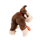peluche Donkey Kong en tissu brun et crème, avec une cravate rouge et une posture de gorille à quatre pattes