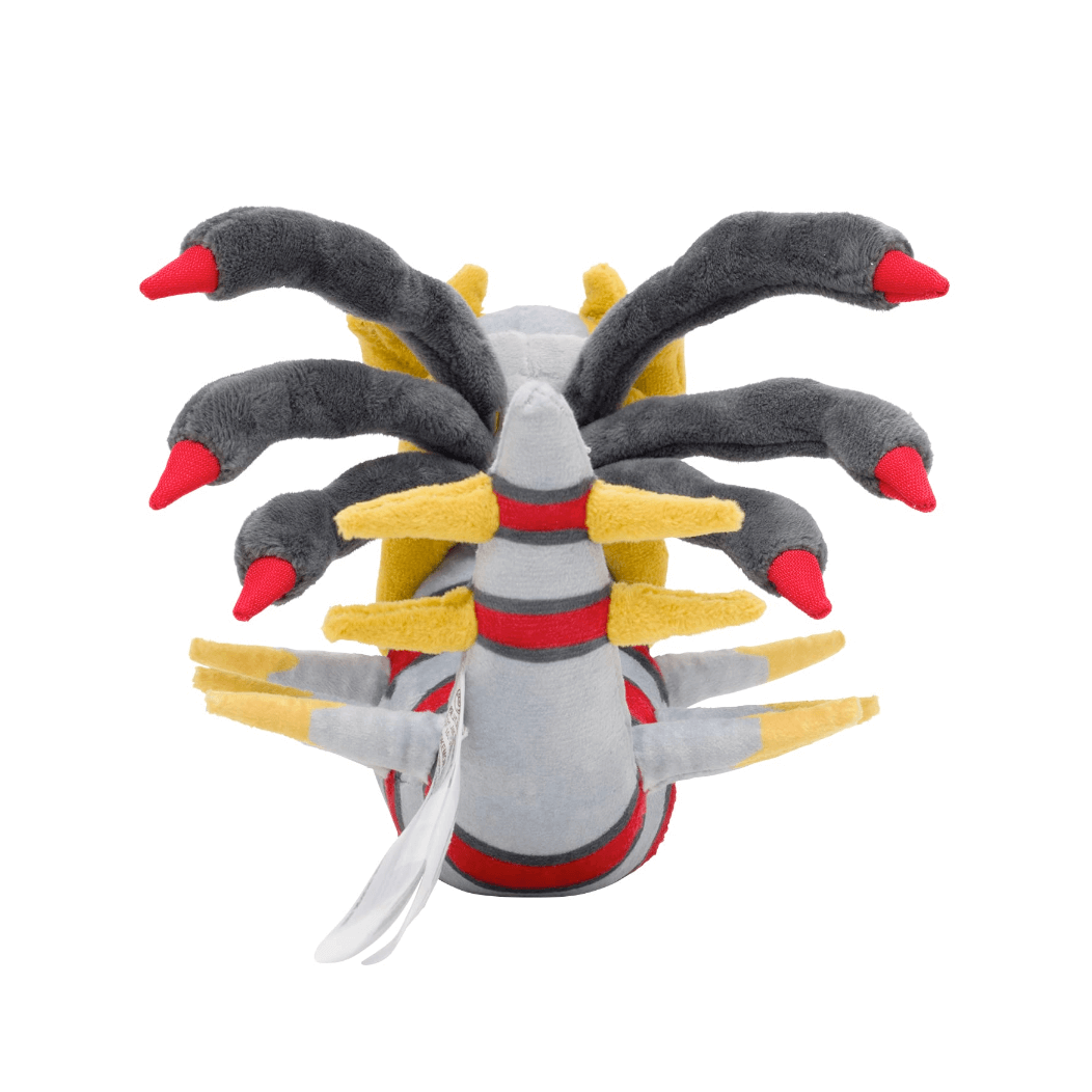 peluche Giratina grise et noire en tissu doux, avec des pointes rouges, des bandes rouges et des appendices jaunes