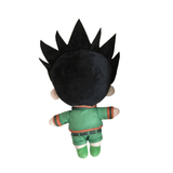 peluche Gon en tissu, vue de dos, avec une chevelure noire hérissée, une tenue verte à bordures orange et des bottes assorties.