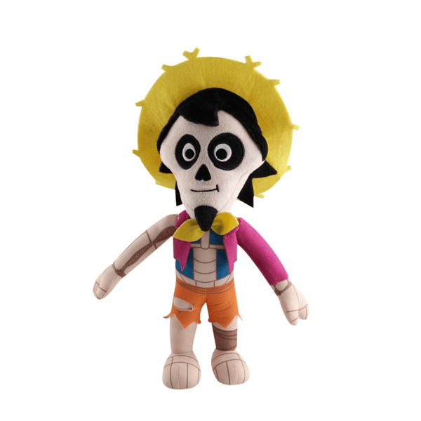 Peluche Hector au visage de squelette blanc, cheveux noirs, grand sombrero jaune, veste rose et pantalon orange.