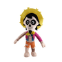 Peluche Hector au visage de squelette blanc, cheveux noirs, grand sombrero jaune, veste rose et pantalon orange.