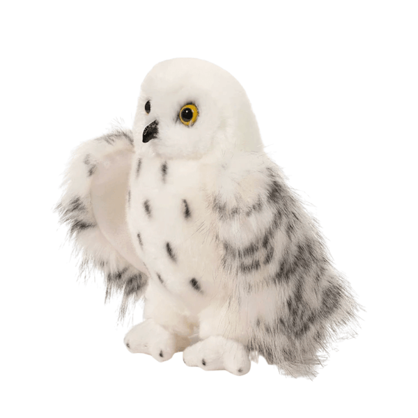 Peluche Hedwige représentant une chouette blanche en peluche douce, avec des taches grises et des yeux jaunes cerclés de noir.