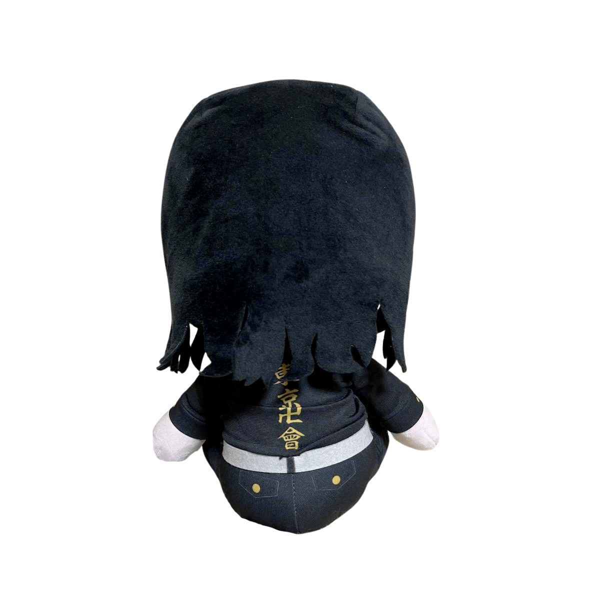 Peluche Keisuke Baji noire en tissu, vue de dos, avec cheveux longs et inscription dorée sur sa tenue.