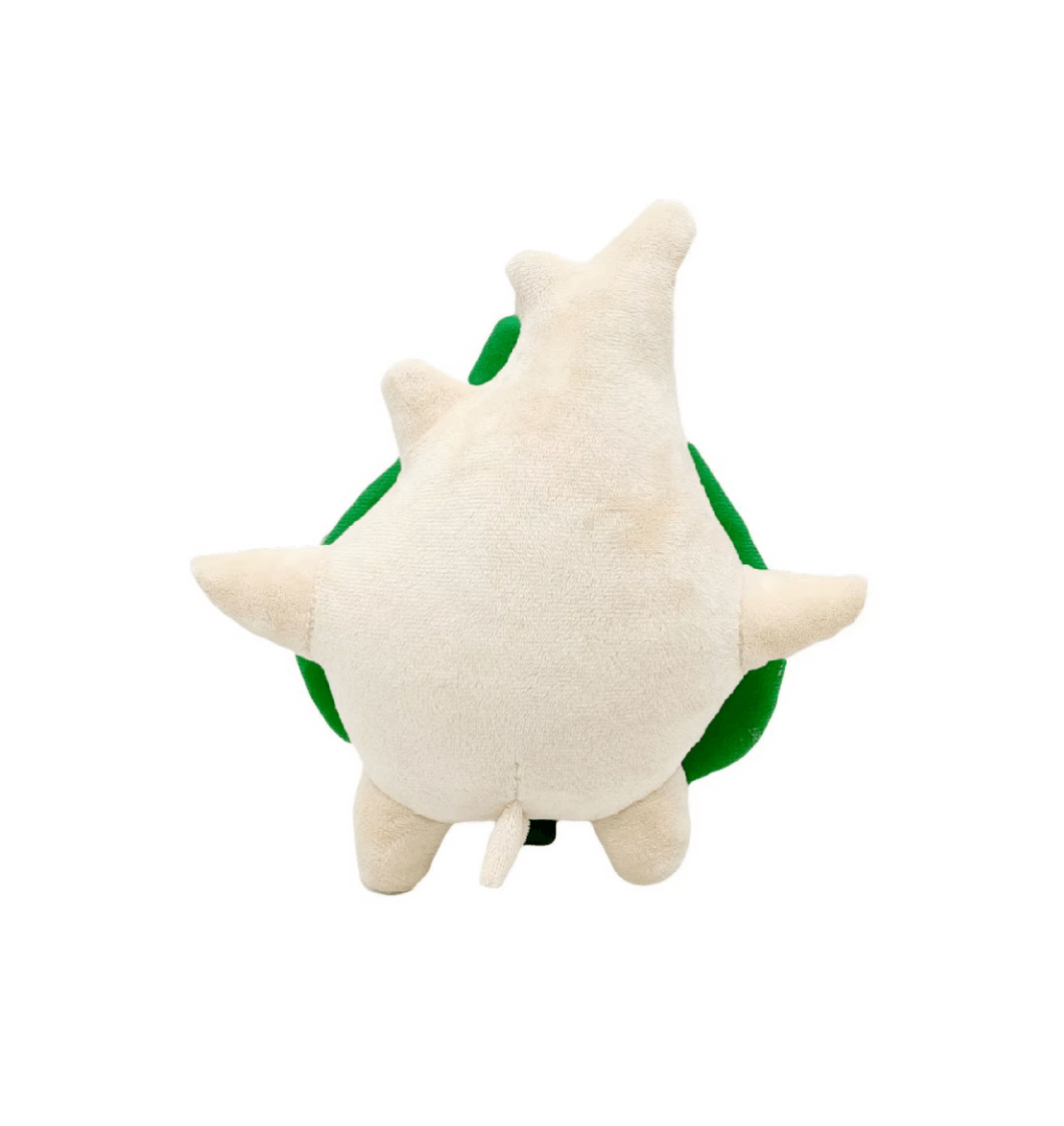 Peluche Korogu beige en tissu doux, vue de dos, avec une grande feuille verte visible sur les côtés.