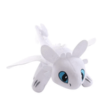 Peluche Light Fury blanche en tissu doux, avec de grands yeux bleus brodés, des ailes et des oreilles dressées.