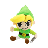 Peluche Link en tissu aux cheveux blonds, bonnet et tunique verts, avec une épée grise à la main.
