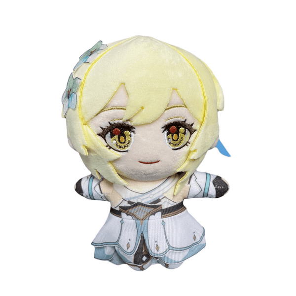 Peluche Lumine blonde aux grands yeux brodés, vêtue d’une robe blanche et bleu pâle avec détails dorés.