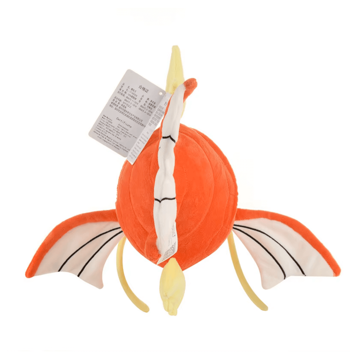 peluche Magicarpe orange et jaune, en tissu doux, avec nageoires latérales déployées et détails noirs brodés