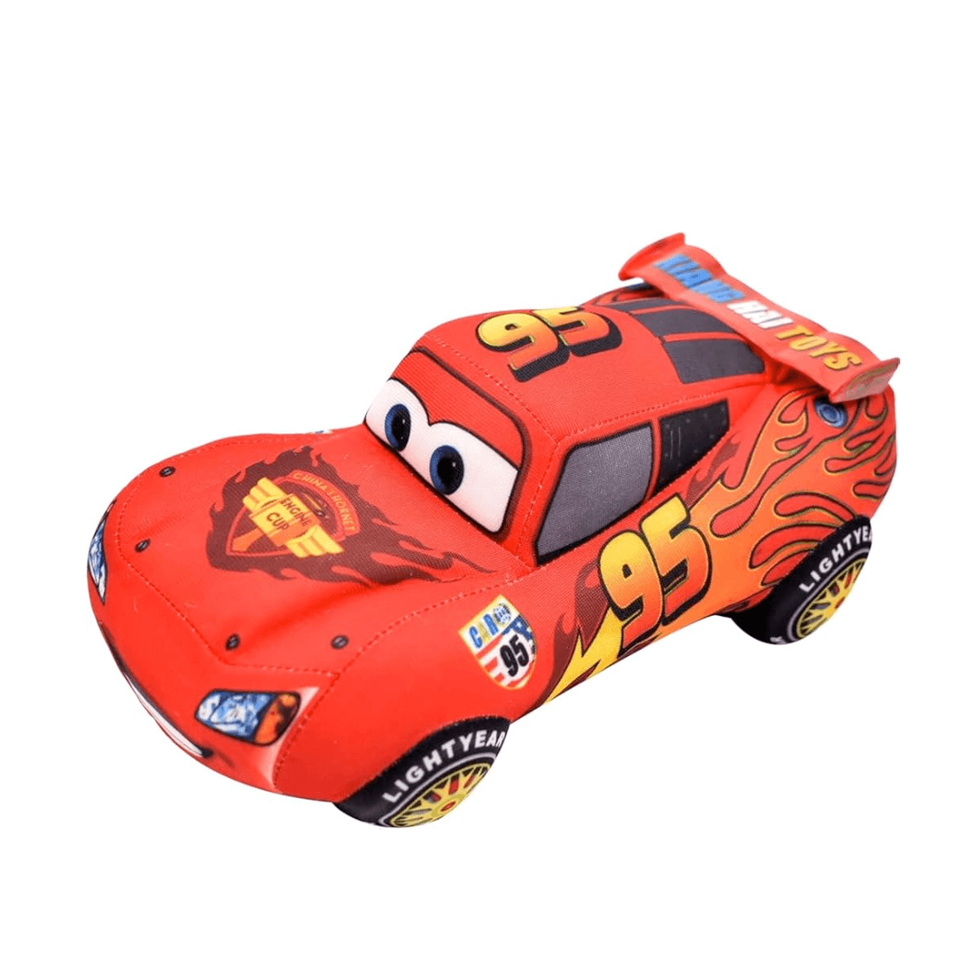 peluche McQueen rouge en tissu, avec yeux brodés, flammes jaunes et numéro 95 sur une voiture de course
