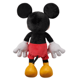 Peluche Mickey Mouse en tissu noir doux, vue de dos, avec un short rouge, des gants blancs et de grandes chaussures jaunes.