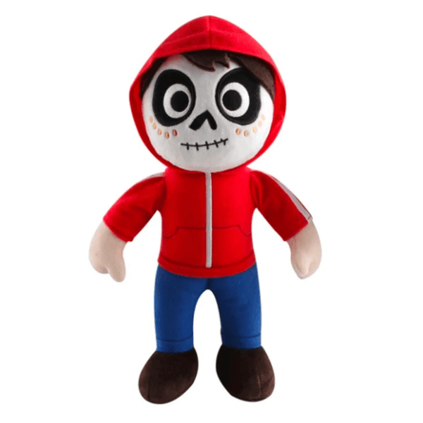 Peluche Miguel Rivera en tissu, avec capuche et haut rouges, pantalon bleu, chaussures brunes et visage de squelette brodé.