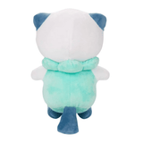 Peluche Moustillon vue de dos, en tissu doux blanc, turquoise et bleu foncé, avec oreilles et queue assorties.