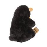 Peluche Niffleur en fausse fourrure noire et duveteuse, avec museau beige, pattes brunes et petite queue touffue.