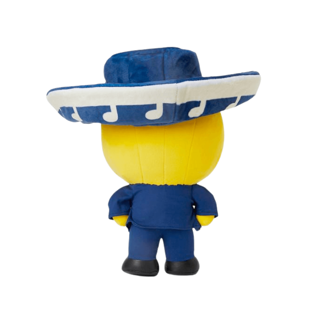 Peluche Poco vue de dos, avec une tête jaune, un costume bleu et un large sombrero blanc orné de motifs bleus.