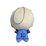 Peluche Raichi Jingo en tissu beige et maillot bleu numéro 10, avec une chaîne porte-clés argentée fixée à la tête.
