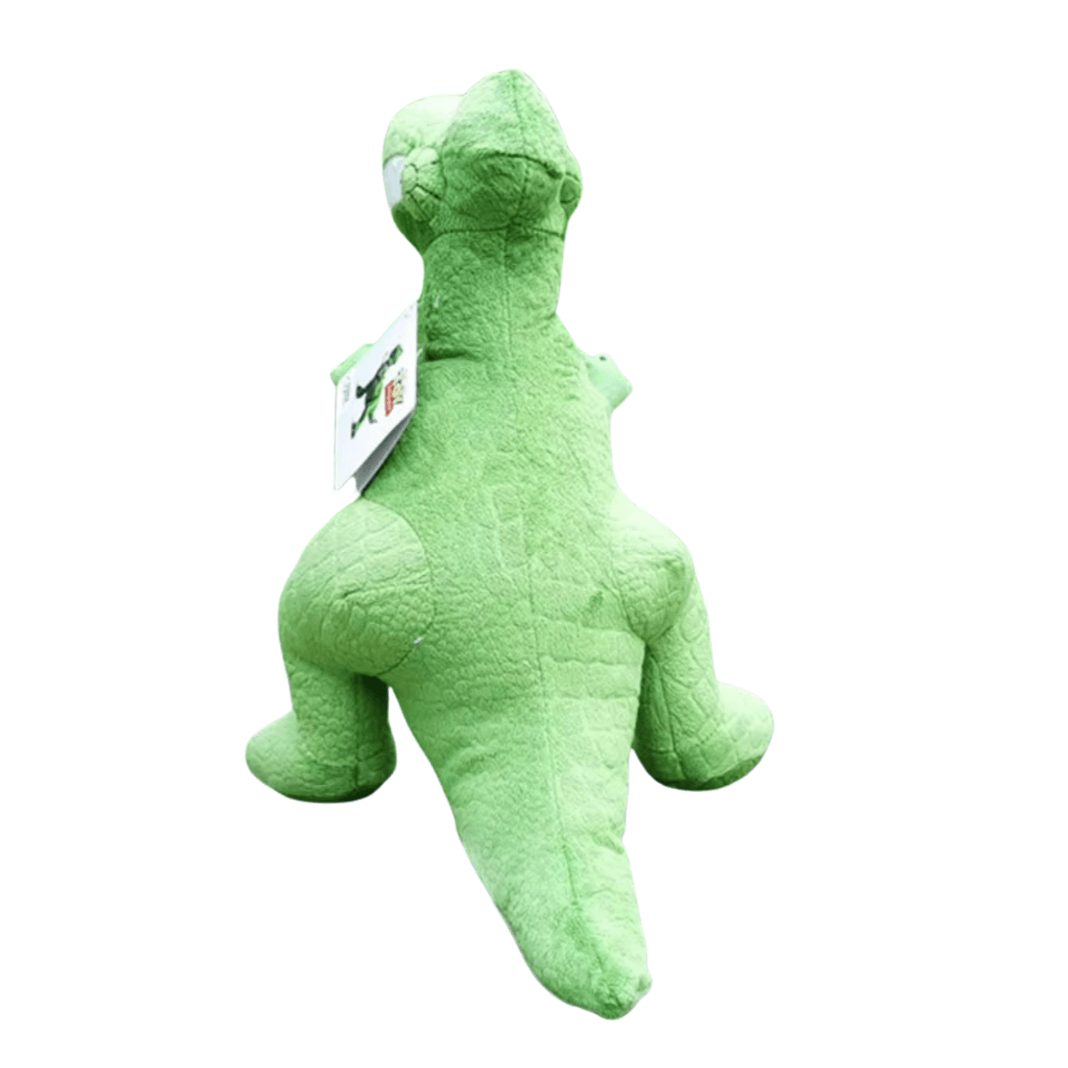 Peluche Rex verte en tissu doux, représentant un dinosaure à la longue queue et aux petits bras, vue de dos.