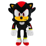 peluche Shadow en tissu noir avec des touches rouges, jaunes et blanches, grands yeux brodés et chaussures rouges