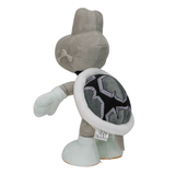Peluche Skelerex grise et beige, avec une carapace noire ornée de motifs géométriques violets et gris.