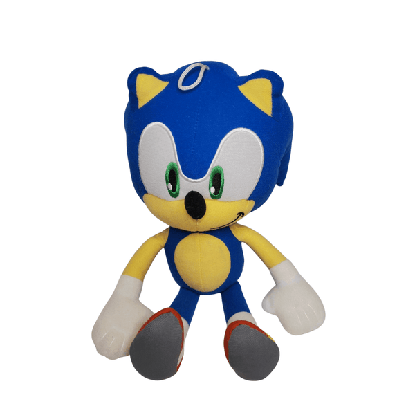 Peluche Sonic bleue en tissu, avec ventre jaune, yeux verts, grandes mains blanches et chaussures rouges et grises.