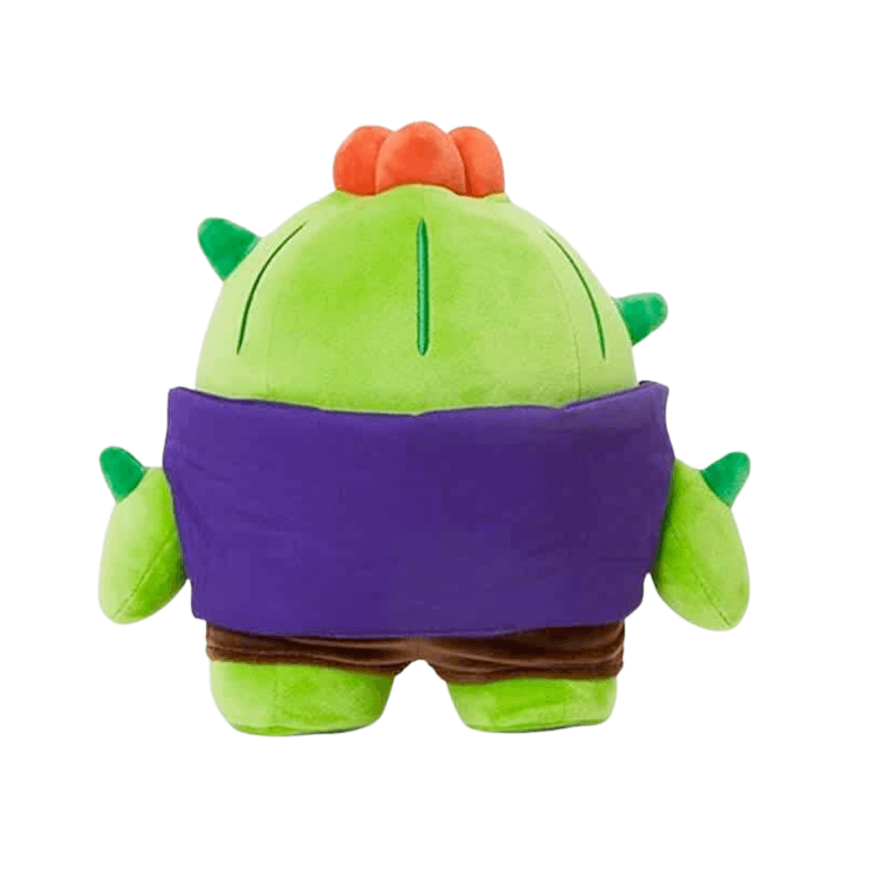 peluche Spike verte aux épines, avec une large bande violette, des détails orange et une forme arrondie