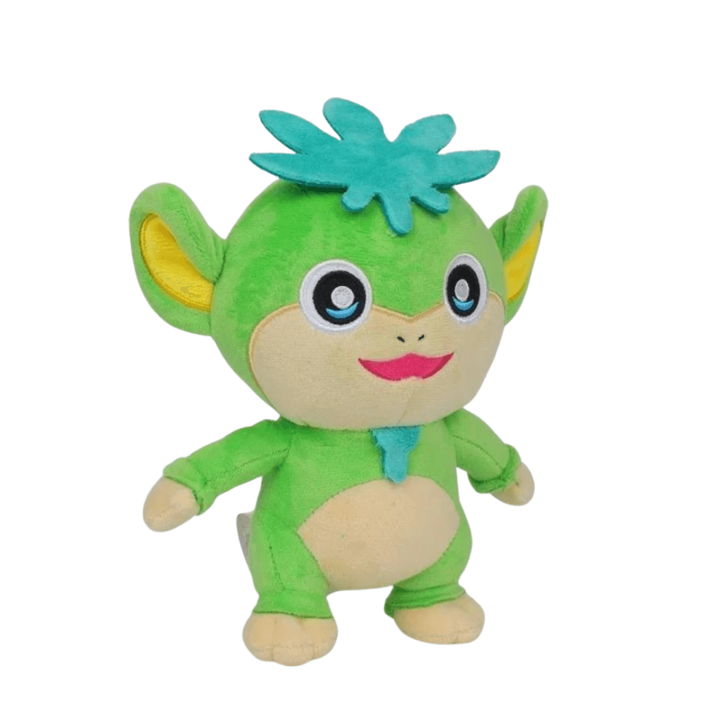 peluche Tanzee verte en tissu doux, avec oreilles jaunes, visage et ventre beiges, touffe turquoise et sourire rose