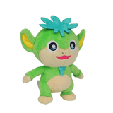 peluche Tanzee verte en tissu doux, avec oreilles jaunes, visage et ventre beiges, touffe turquoise et sourire rose