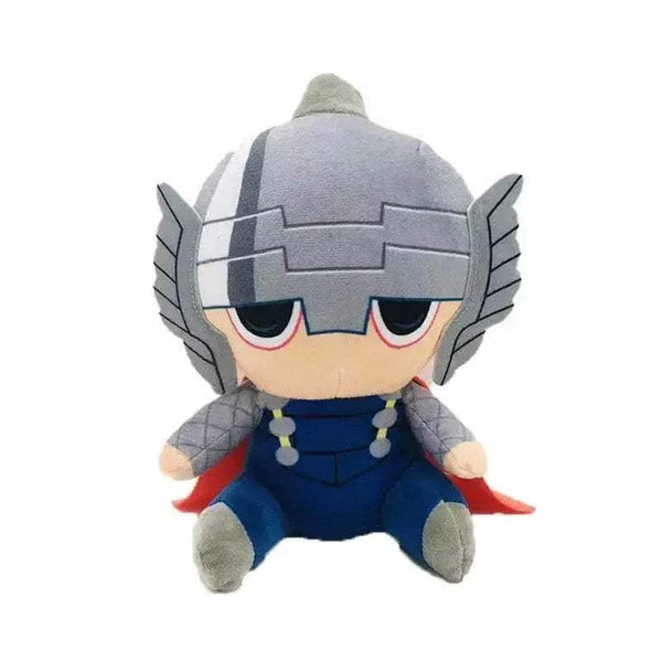 Peluche Thor aux cheveux blonds, portant un casque gris à ailes, une armure bleue et une cape rouge.