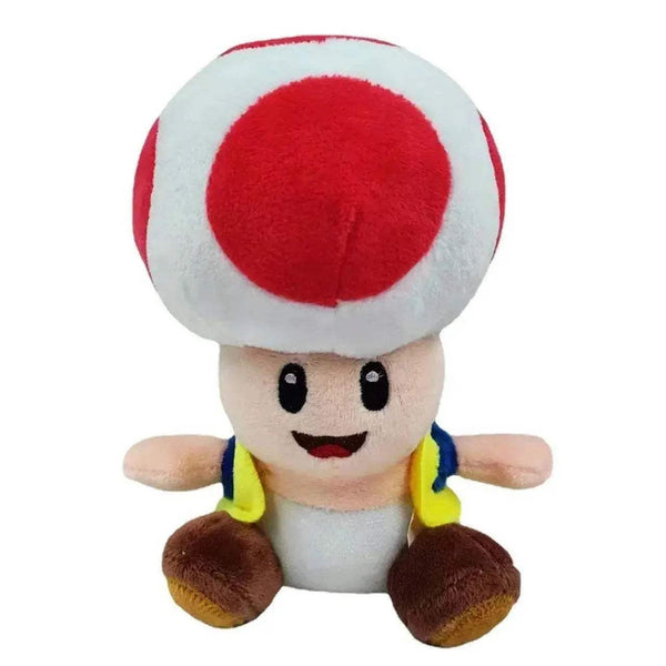 Peluche Toad en tissu doux, avec champignon blanc à pois rouge, visage souriant et chaussures brunes.