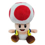 Peluche Toad en tissu doux, avec champignon blanc à pois rouge, visage souriant et chaussures brunes.