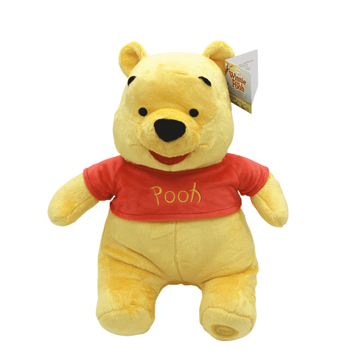 Peluche Winnie jaune en tissu doux, vêtue d’un tee-shirt rouge marqué « Pooh », avec un sourire brodé.
