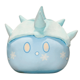 Peluche peluches Blob bleue en tissu doux, ornée de flocons blancs, avec des yeux ovales et des pointes sur la tête.