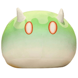 Peluche peluches Blob verte et crème, en tissu doux, avec des motifs ondulés, deux cornes blanches et des yeux ovales orange.